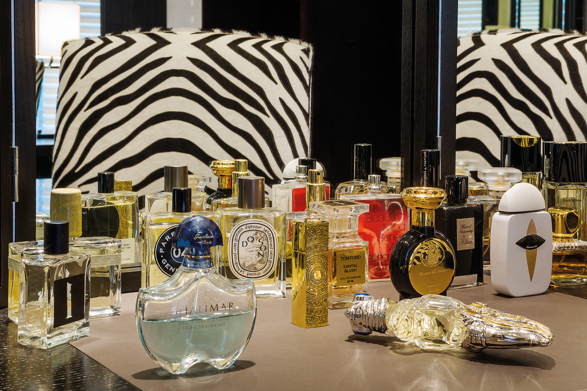 Perfumes lined up at the make-up desk 