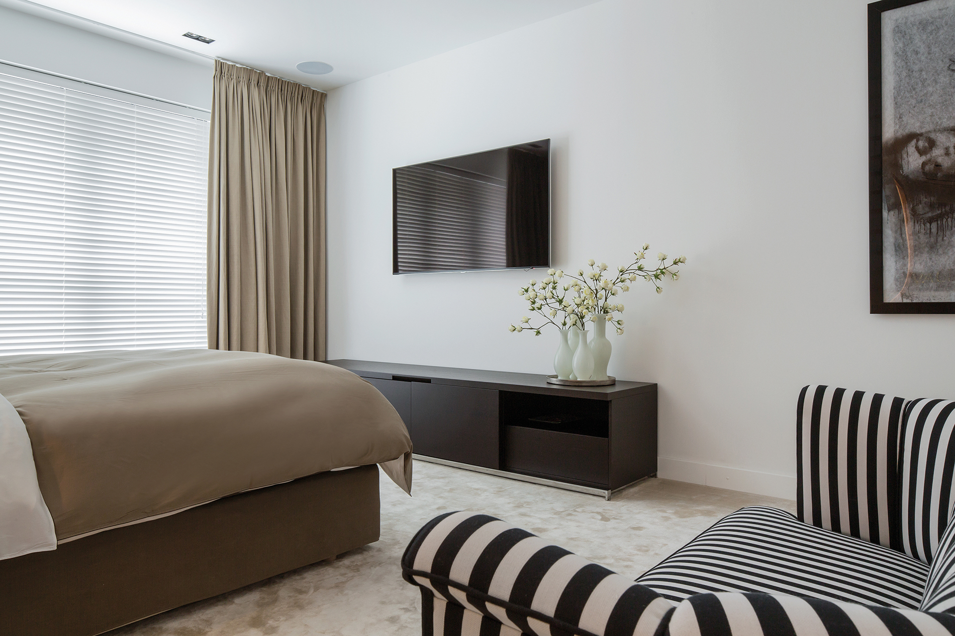 Guestroom with bed storage and television